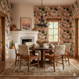 Sonora clay wallpaper with green and brown terrazzo pattern, covering the walls of a traditionally decorated dining room.