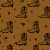 Kodiak Dust Wallpaper with brown cowboy boot and star pattern.