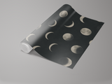 Black lunar phases wallpaper with moon pattern details.