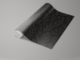 Dark floral wallpaper by Noir Botanica with a leaf and branch pattern.