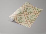 Tuscany trellis wallpaper with green leaf pattern on a roll.