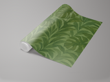 Green tropical leaf wallpaper with a Monstera leaf pattern.