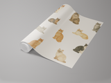 Patterned wallpaper by Cat's Meow featuring watercolor-style cats in various poses on a neutral background, rolled slightly.