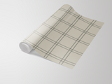 Roll of endearing plaid wallpaper by RoomMates, featuring a neutral backdrop with a subtle grey grid pattern.