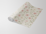 Floral garden trellis wallpaper from an unbranded source, rolled up at the left, with a delicate trellis pattern and pink flowers.