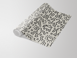 Repeating pattern wallpaper from Haring Playhouse featuring cartoon figures and hearts