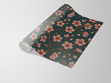 Floral midnight wallpaper with cherry blossom design by a vendor, shown on a roll.
