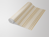 Roll of striped wallpaper in cream and gold with a classic pattern.