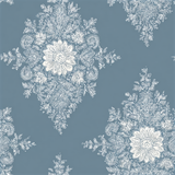 Blue wallpaper with white floral lace pattern.
