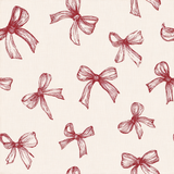 Patterned wallpaper with bow print, textured design.
