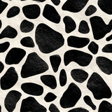 Black and off-white hide wallpaper featuring a cow-like pattern and textured surface.
