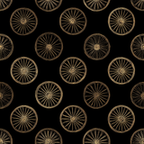 Frontier wheelhouse wallpaper with repeating gold wheel pattern on a black background.

