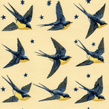 Patterned wallpaper with blue and yellow swallows flying amongst navy stars.