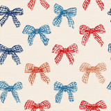 Patterned wallpaper with blue and red bows on a cream background.
