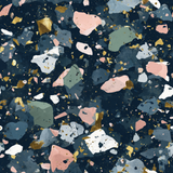 Colorful terrazzo wallpaper with golden flecks, from Celeste Oro, featuring pink, white, and green chips on a navy background.
