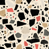 Terrazzo wallpaper with red rock detail featuring a speckled pattern.
