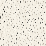 Ink scatter wallpaper with scattered black dashes on off-white textured background.