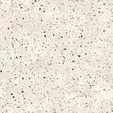 Grain wallpaper with beige background by Lido, speckled with colorful terrazzo-like chips.
